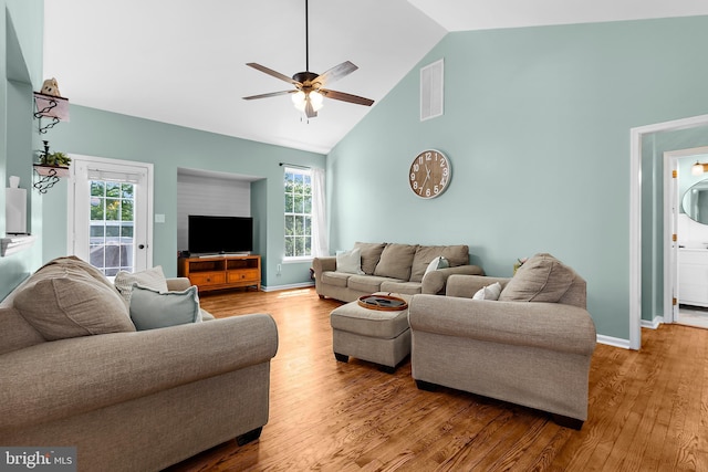 11312 Rawhide Rd, Lusby, MD 20657 - living room featuring visible vents, wood finished floors, baseboards, high vaulted ceiling, and a ceiling fan