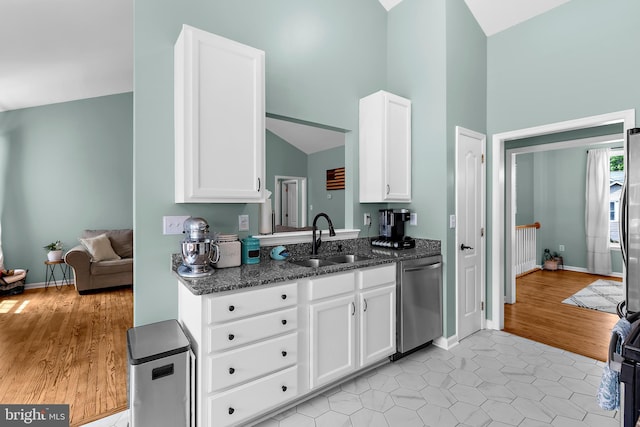11312 Rawhide Rd, Lusby, MD 20657 - kitchen featuring white cabinets, a sink, and dishwasher