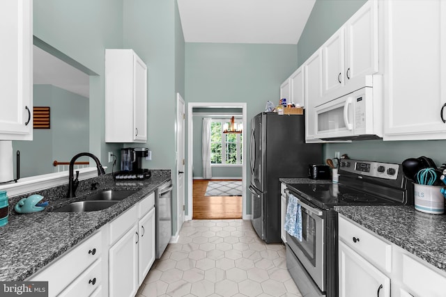 11312 Rawhide Rd, Lusby, MD 20657 - kitchen with a sink, white cabinets, and stainless steel appliances