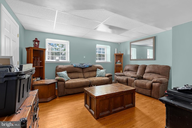 11312 Rawhide Rd, Lusby, MD 20657 - living area featuring light wood-type flooring and a paneled ceiling