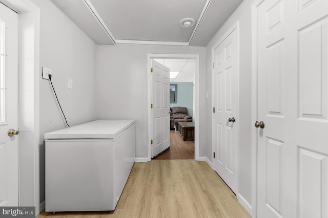 11312 Rawhide Rd, Lusby, MD 20657 - hallway with light wood-type flooring and baseboards