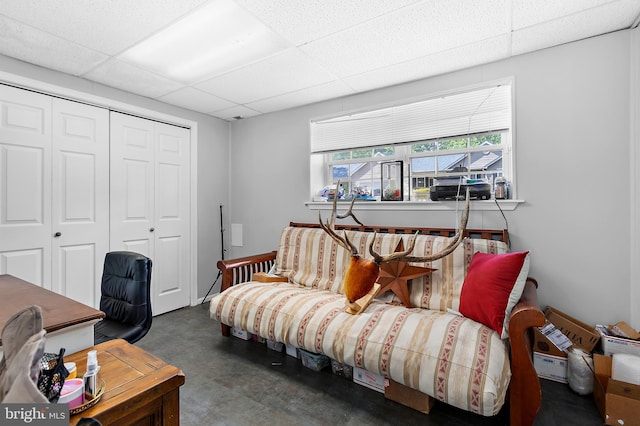 11312 Rawhide Rd, Lusby, MD 20657 - living area featuring a paneled ceiling and finished concrete flooring