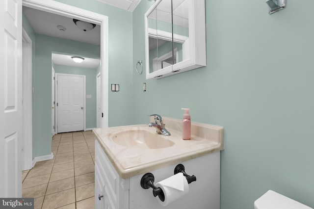 11312 Rawhide Rd, Lusby, MD 20657 - half bathroom featuring toilet, tile patterned floors, and vanity