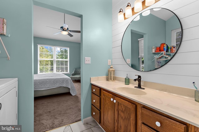 11312 Rawhide Rd, Lusby, MD 20657 - bathroom featuring ceiling fan, ensuite bath, marble finish floor, and vanity