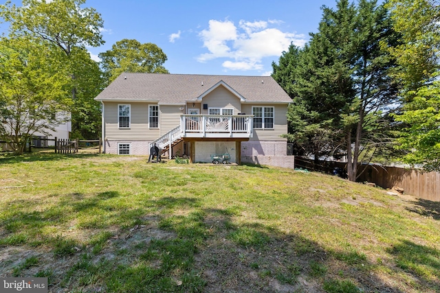 11312 Rawhide Rd, Lusby, MD 20657 - back of property featuring stairs, a fenced backyard, a lawn, and a wooden deck