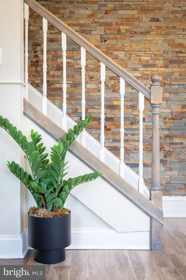 stairs with baseboards and wood finished floors