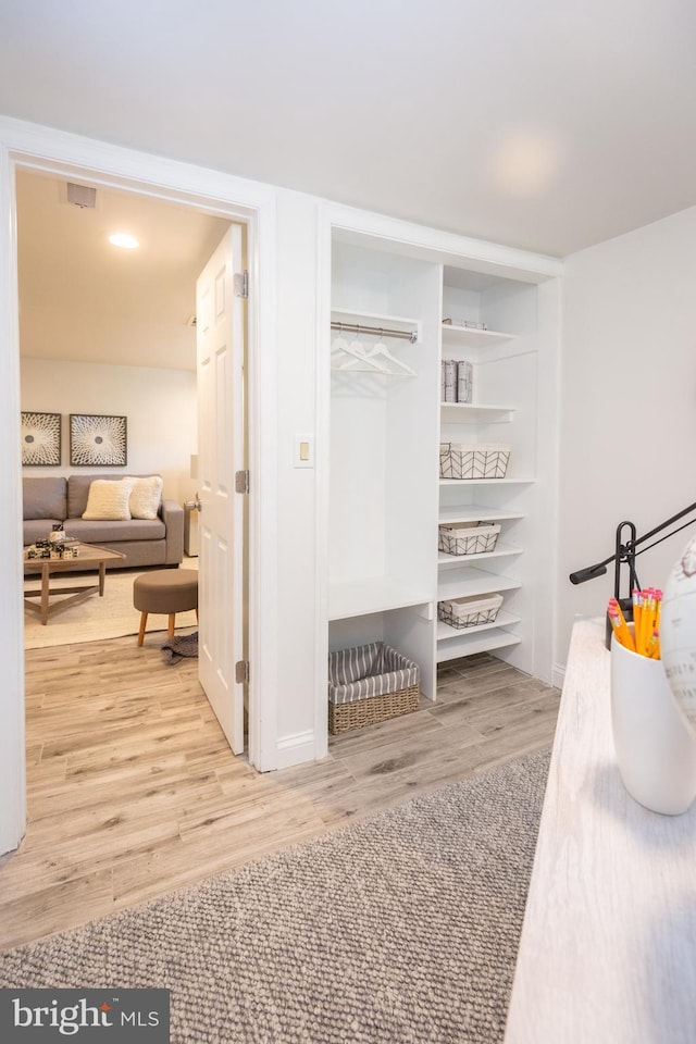 mudroom featuring visible vents and wood finished floors