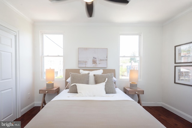 bedroom with baseboards, ornamental molding, ceiling fan, and dark wood-style floors