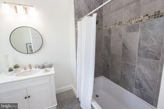 full bath featuring vanity, baseboards, and shower / bathtub combination with curtain