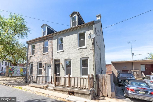 view of front of home featuring a chimney