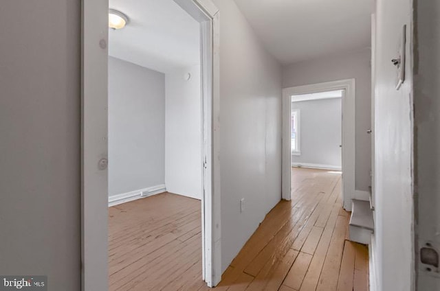 corridor featuring light wood-style flooring