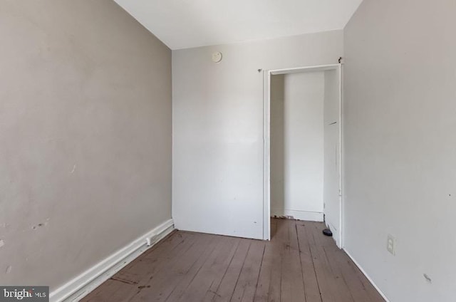 spare room featuring hardwood / wood-style flooring