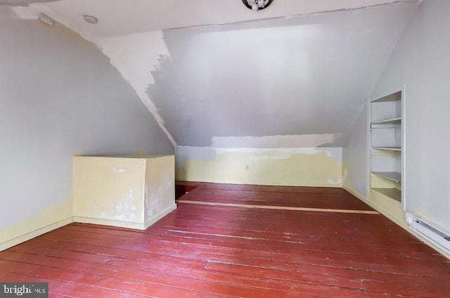 bonus room with wood-type flooring, baseboards, and lofted ceiling