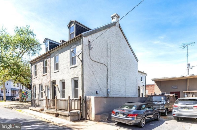 view of front of home with a chimney