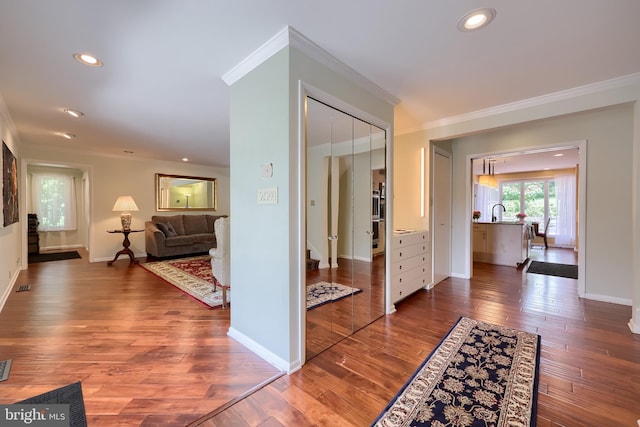 1515 Rockland St, Reading, PA 19604 - hall featuring crown molding, wood finished floors, a sink, baseboards, and recessed lighting