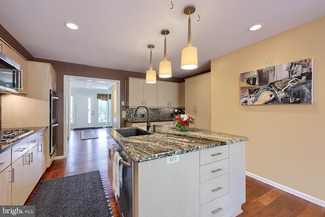1515 Rockland St, Reading, PA 19604 - kitchen with a sink, stainless steel appliances, dark wood-type flooring, white cabinetry, and dark stone countertops