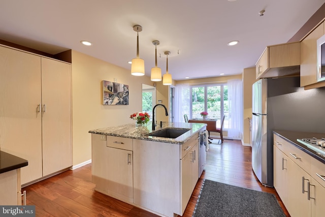 1515 Rockland St, Reading, PA 19604 - kitchen featuring a sink, hardwood / wood-style flooring, light stone countertops, a center island with sink, and recessed lighting