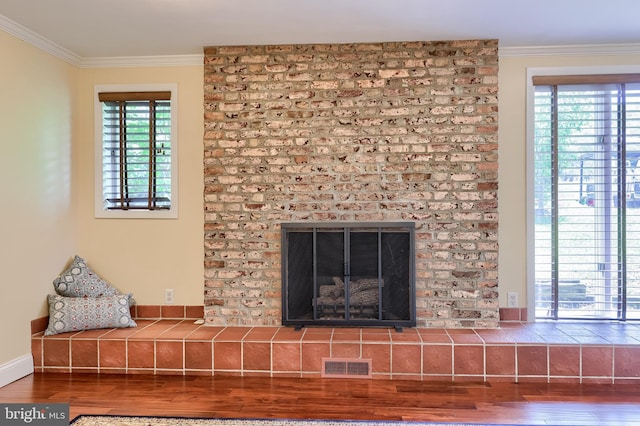1515 Rockland St, Reading, PA 19604 - detailed view of ornamental molding, wood finished floors, a fireplace, and baseboards