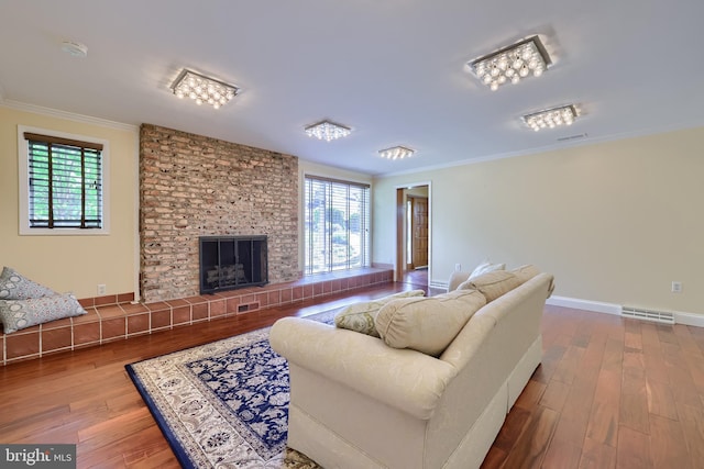 1515 Rockland St, Reading, PA 19604 - living area featuring ornamental molding, wood finished floors, plenty of natural light, and a fireplace