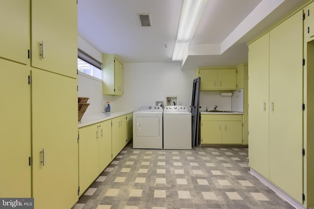 1515 Rockland St, Reading, PA 19604 - laundry area with cabinet space, washer and dryer, and light floors