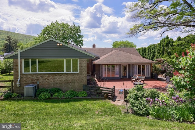 1515 Rockland St, Reading, PA 19604 - back of house with brick siding, central air condition unit, and a patio
