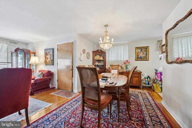 603 Bywood Ave, Upper Darby, PA 19082 - dining space featuring baseboards, a chandelier, and wood finished floors