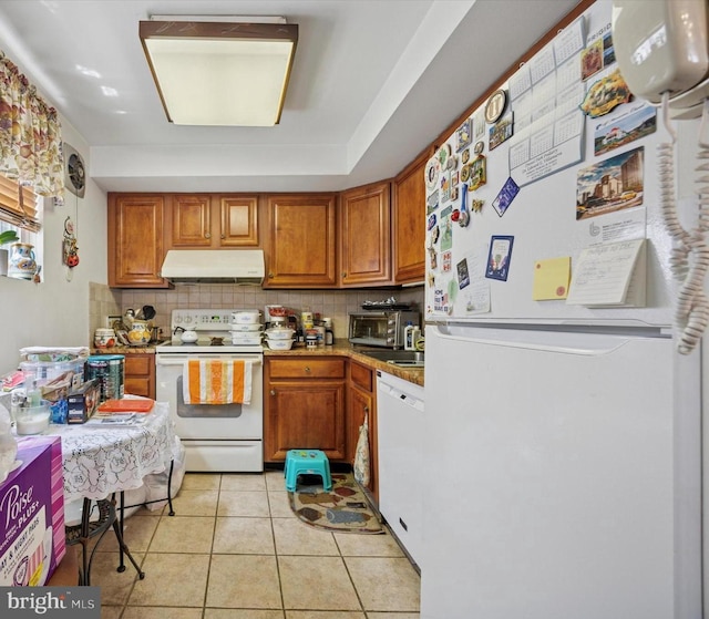603 Bywood Ave, Upper Darby, PA 19082 - kitchen with brown cabinetry, white appliances, decorative backsplash, and exhaust hood
