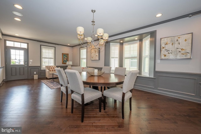 dining space featuring recessed lighting, ornamental molding, dark wood finished floors, and a notable chandelier