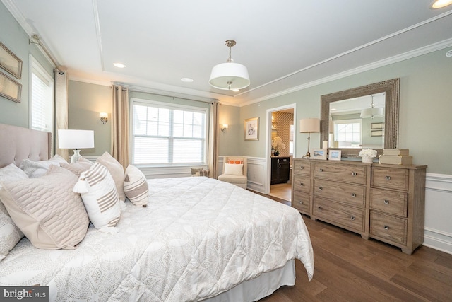 bedroom featuring crown molding, recessed lighting, wainscoting, and wood finished floors