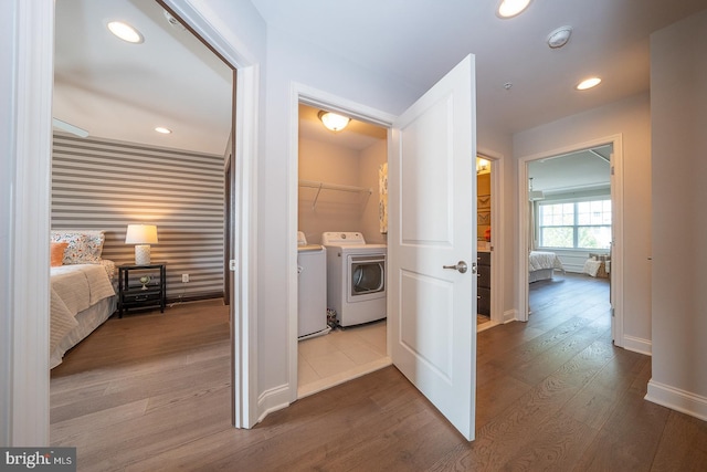 washroom featuring laundry area, baseboards, separate washer and dryer, recessed lighting, and dark wood-type flooring
