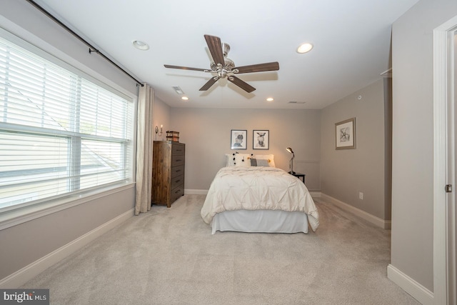 bedroom with recessed lighting, baseboards, light carpet, and a ceiling fan