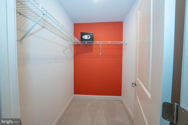 walk in closet featuring carpet floors