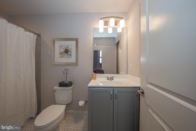 bathroom with tile patterned flooring, vanity, toilet, baseboards, and a shower with curtain