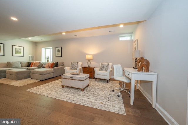 living area featuring recessed lighting, baseboards, visible vents, and wood finished floors