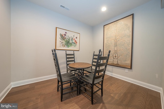 dining space with recessed lighting, baseboards, visible vents, and wood finished floors