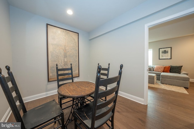 dining room with baseboards, recessed lighting, and wood finished floors