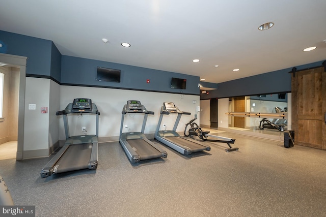 exercise room featuring recessed lighting and baseboards