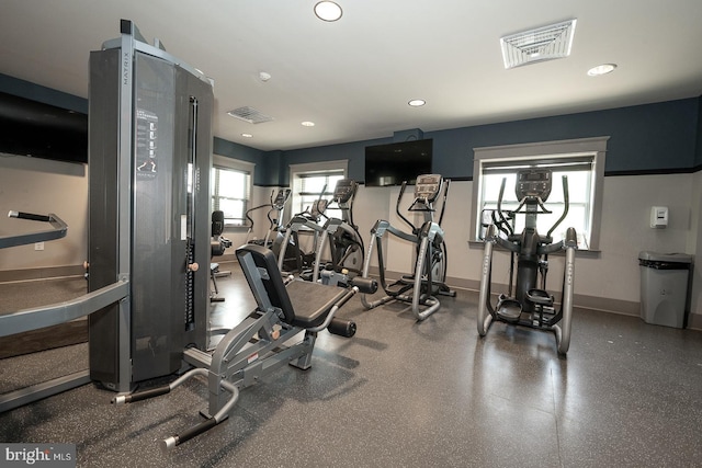 exercise room with baseboards, recessed lighting, and visible vents
