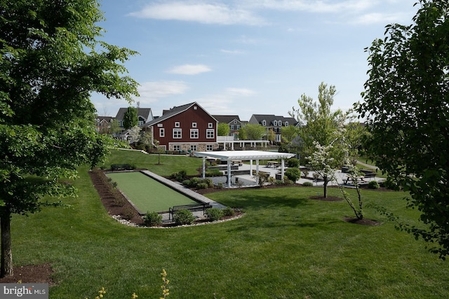 view of community with a yard and a residential view