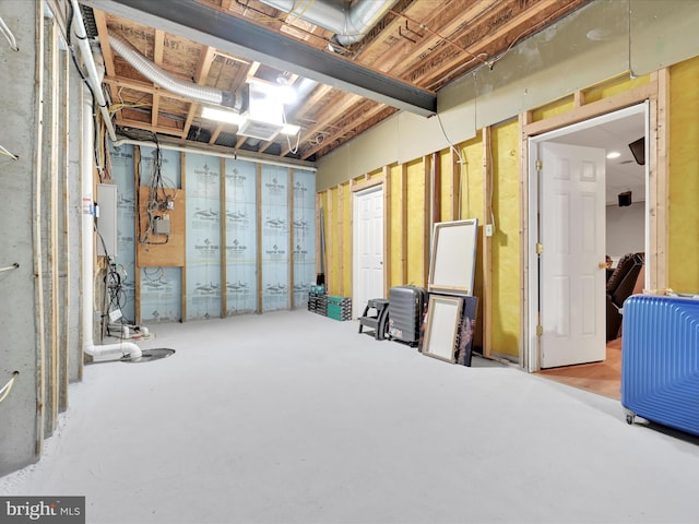 unfinished below grade area featuring water heater