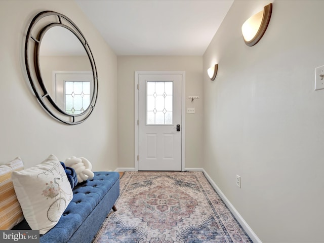 entryway featuring baseboards