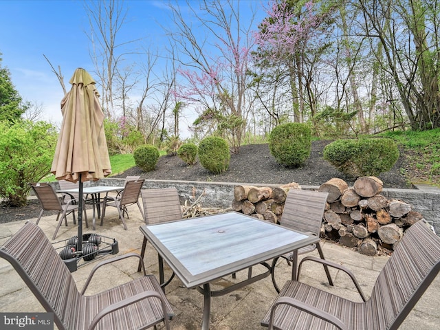 view of patio featuring outdoor dining area