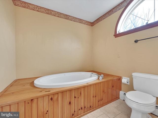 bathroom featuring a garden tub, a baseboard radiator, tile patterned flooring, and toilet
