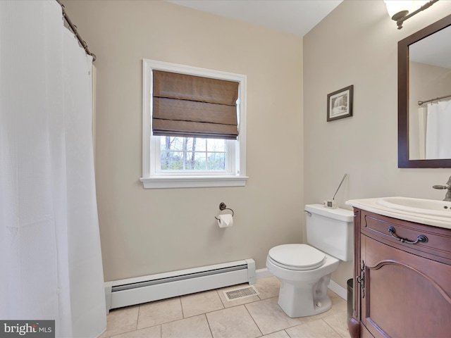 bathroom featuring vanity, tile patterned floors, baseboards, a baseboard heating unit, and toilet