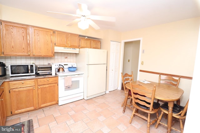 18 Stearrett Dr, Newark, DE 19702 - kitchen with white appliances, under cabinet range hood, backsplash, ceiling fan, and stone finish floors