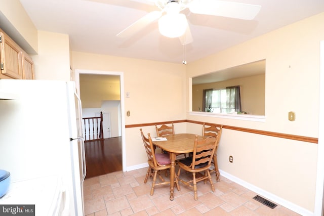 18 Stearrett Dr, Newark, DE 19702 - dining space with a ceiling fan, light stone finish flooring, and baseboards