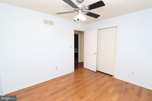 18 Stearrett Dr, Newark, DE 19702 - unfurnished bedroom featuring light wood finished floors, baseboards, a closet, and a ceiling fan