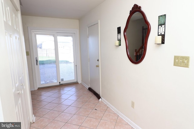 18 Stearrett Dr, Newark, DE 19702 - doorway to outside with light tile patterned flooring and baseboards