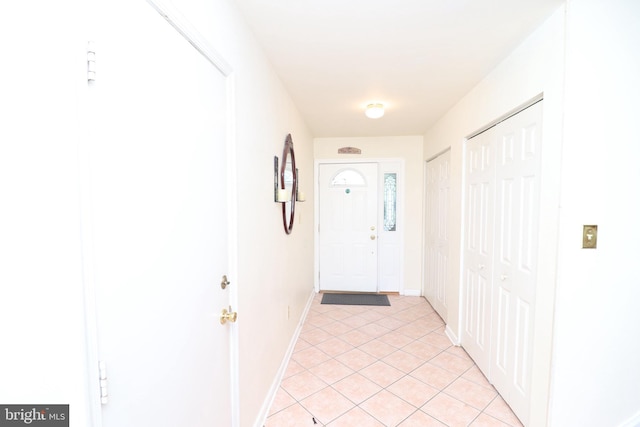 18 Stearrett Dr, Newark, DE 19702 - doorway to outside featuring light tile patterned floors and baseboards