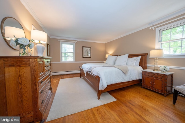 bedroom featuring light wood-style flooring, baseboard heating, and ornamental molding